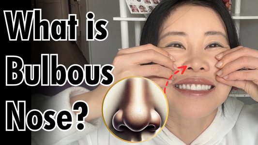 Woman pressing her nose and smiling to show what a bulbous nose looks like.
