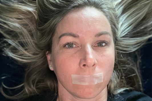 Thumbnail for a blog post titled 'Does Mouth Tape Stop Snoring?', exploring the effectiveness of using mouth tape as a simple solution to reduce or eliminate snoring by promoting nasal breathing.