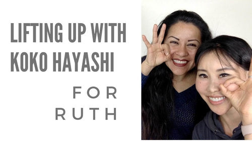 Koko Hayashi smiling with a participant at the Lifting Up with Koko Face Yoga event for Ruth, highlighting face yoga techniques.
