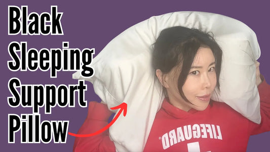 Woman demonstrating how side sleeping with a support pillow could be affecting your face.